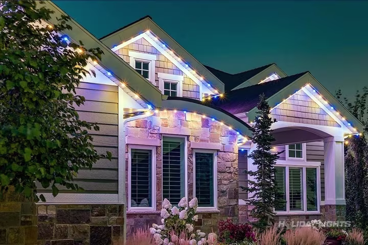 App-controlled permanent LED lighting on a Massachusetts home facade