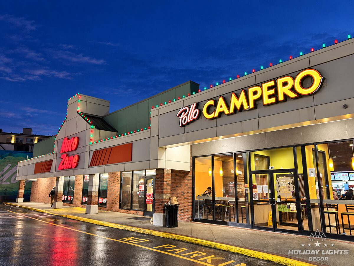 Red and green roofline lights run above two storefront sections and a raised facade.