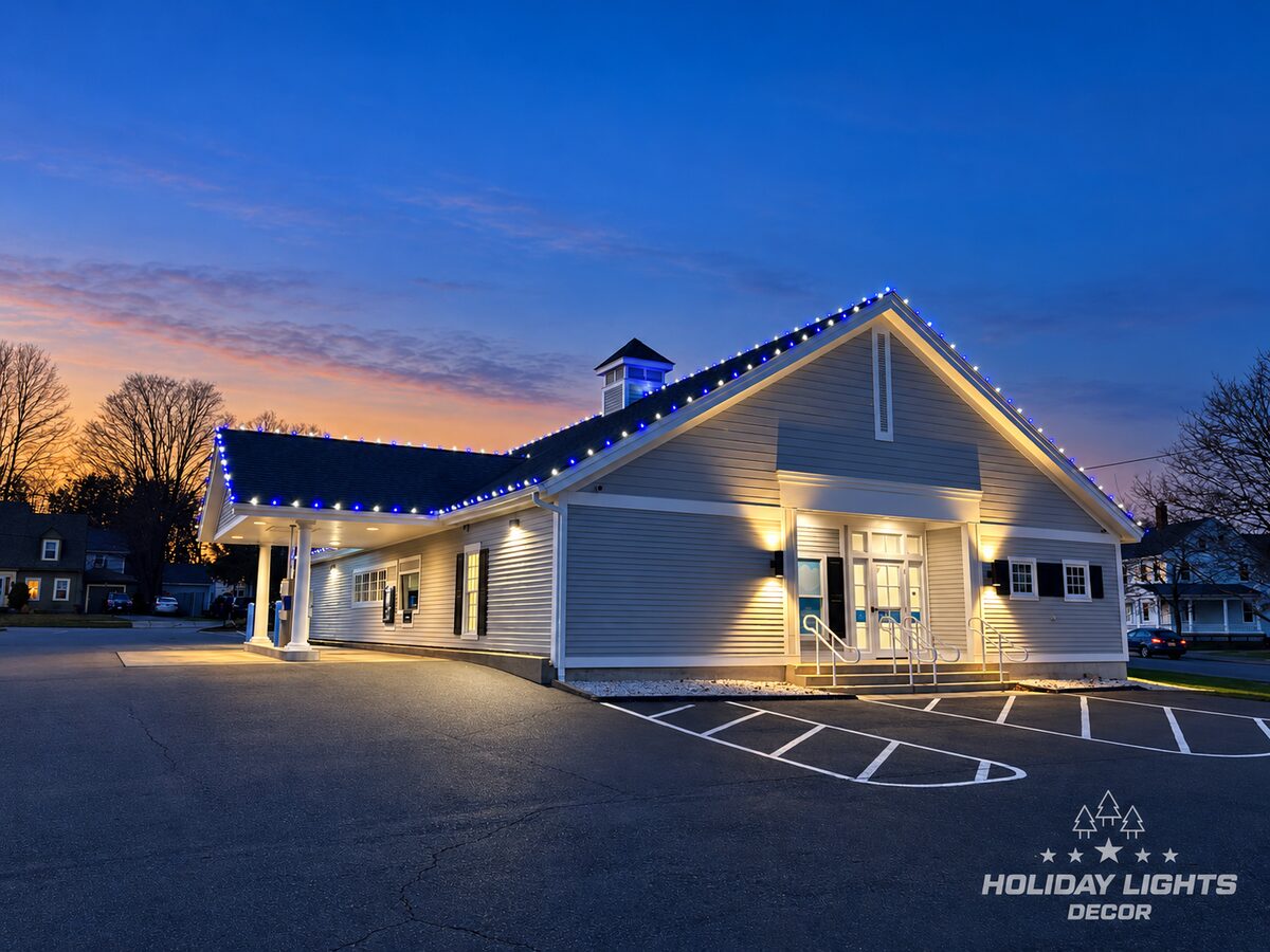Angled view showing the entrance, side elevation, and covered canopy.