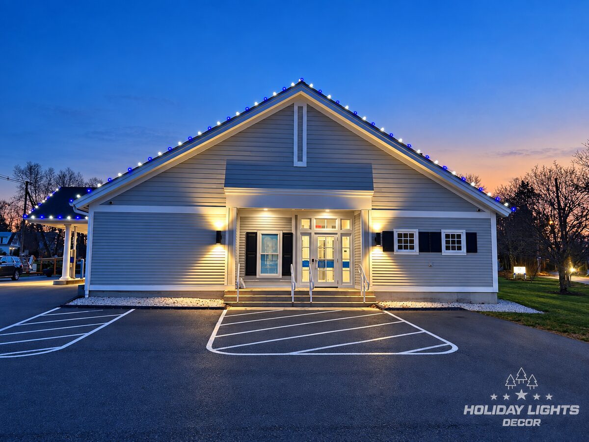 Centered entrance view highlighting the illuminated front gable.